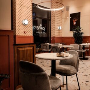 Home Warm and inviting cafe interior in Yerevan, Armenia with modern furnishings and ambient lighting.